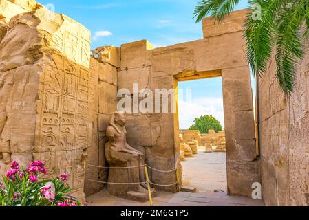 Seated statue in Karnak Stock Photo