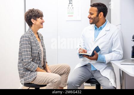 Mid aged woman having a visti to ophtalmologist Stock Photo