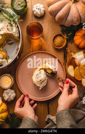 Cinnamon pumpkin dough bun rolls spicy homemade traditional Danish baked vegan sweet fall treat cake holiday dessert swirl bread pastry food with raw Stock Photo