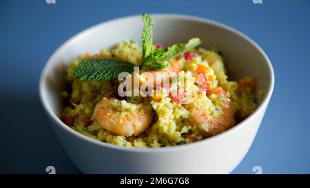 Fake Risotto with shredded cabbage and curry prawns. Stock Photo