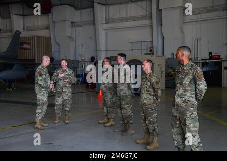 Members from the 301st Fighter Wing stand in a hanger at Naval Air Station Joint Reserve Base Fort Worth on April 27, 2022. The 301 FW led the civic leaders on a tour of the wing’s facilities and highlighted its capabilities, showing them how his Reserve Citizen Airmen maintain and fly their F-16 Fighting Falcons. Stock Photo