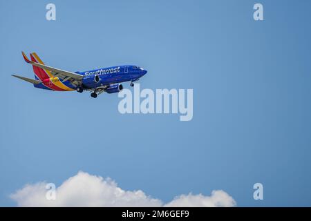 Southwest Airlines Boeing 737 commercial jet airplane in flight shortly before landing at the Orlando International Airport (MCO). Stock Photo