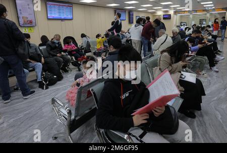 People apply for Home Return Permit at Hong Kong Island Service Centre of China Travel Service Hong Kong Ltd (CTS) in Sheung Wan. 29DEC22   SCMP / Jelly Tse Stock Photo