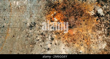 Shabby Rusty Wall. Stone texture with rust. Ancient Inscription. Corrosion Surface. Grunge Banner Stock Photo