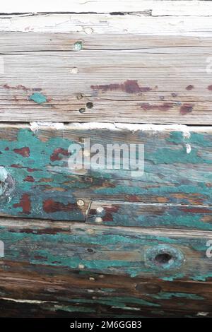 Close up of peeling paint on a wooden boat. Stock Photo