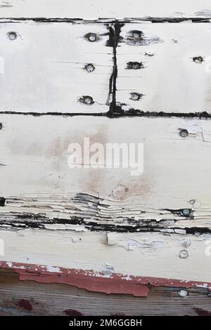 Close up of peeling paint on a wooden boat. Stock Photo