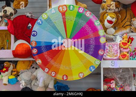 Colourful Spinning Wheel of Fortune Spinner Target Game at Fun Fair Stock Photo