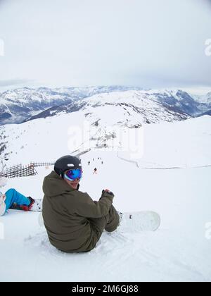A snow board waits at the top of a run in Sauze D'Oulx Stock Photo