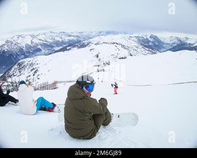 A snow board waits at the top of a run in Sauze D'Oulx Stock Photo