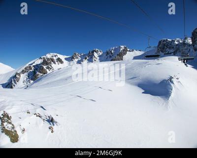 A view from the skit chairlift riding from Sauze d'Oulx to Mont Genevre Stock Photo