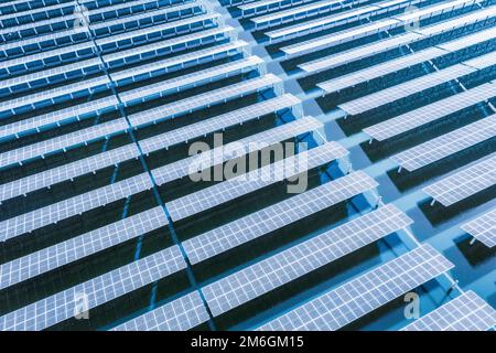 Solar panels on blue water surface Stock Photo