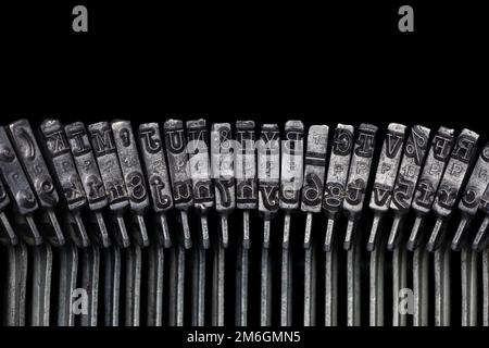 Old, vintage typewriter letters. Journalism, print media, news and writing concept. Stock Photo