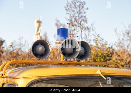 Siren and blue flasher on the roof of an old police car Stock Photo