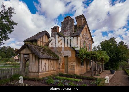 Queenâ€™s Hamlet (Le Hameau de la Reine) - Rural House Buildings - Marie-Antoinette in Versailles Palace Gardens (Chateau de Ver Stock Photo