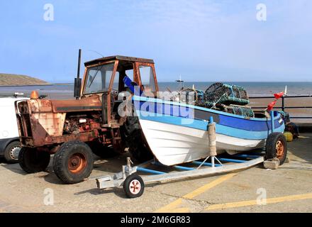 Tractor landing fishing boat Filey North Stock Photo - Alamy