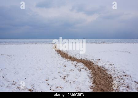 A view of the Gold Coast and Oak Street Beach area of the Chicago lake Shore in winter, covered in snow and ice Stock Photo