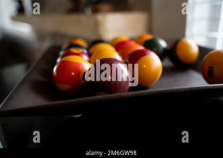 pool balls in wooden tray Stock Photo
