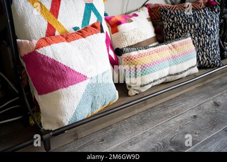 decorative pillows on iron shelf Stock Photo