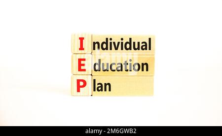 IEP individual education plan symbol. Concept words IEP individual education plan on wooden blocks on beautiful white table white background. Business Stock Photo