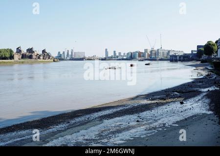 A view of the south bank of the river thames at low tide at Greenwich looking towards Poplar Stock Photo