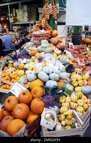 Fresh vibrant ripe pumpkins and squash on sale in a market Stock Photo