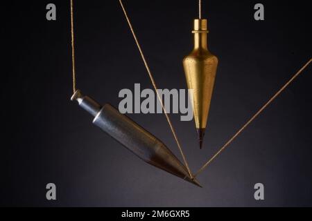 Plumb bobs, antique surveying equipment Stock Photo