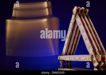 Plumb bob & carpenter's scale, antique surveying equipment Stock Photo