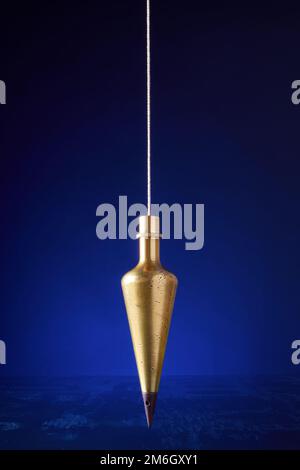 Plumb bob, antique surveying equipment Stock Photo