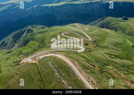 Winding road passing through mountain Stock Photo