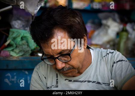 Vadodara, Gujarat - November 19th 2022: Aged Indian man close up face with wrinkled skin and grey hair good and beautiful face Stock Photo