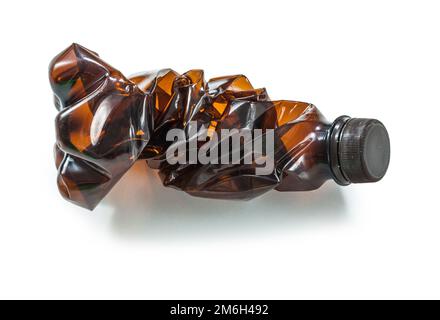 brown crumpled plastic bottle isolated Stock Photo
