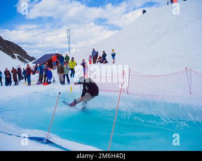 Russia, Sochi 11.05.2019. The guy rides cool on the water and is photographed by the audience. Snowboard competition on the wate Stock Photo