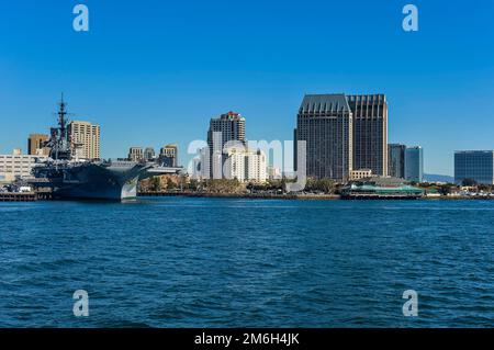Skyline of San Diego with the USS Midway, California, USA Stock Photo