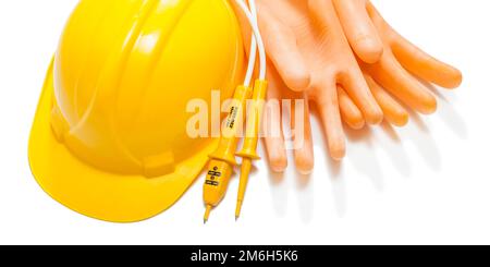 helmet dielectric gloves and electric tester isolated Stock Photo