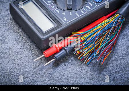 Set of digital multimeter electric tester wires on black background electricity concept. Stock Photo