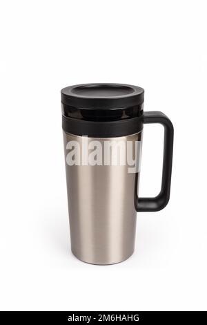 Thermos and Mug with Hot Drink Standing on Wet Wooden Table after