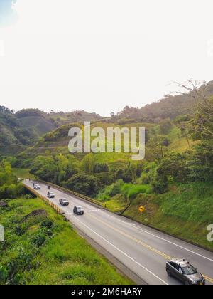 sunset on a Colombian road. La Romelia-El Pollo variant, Colombian road through the mountains. Stock Photo