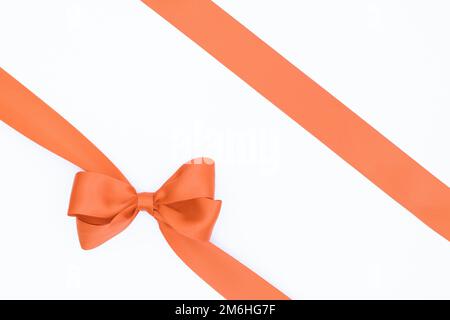 Orange bow, ribbon. Isolated. On white background , #sponsored