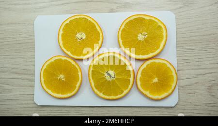 Sliced oranges for drying on paper Stock Photo