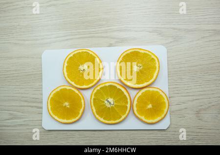 Sliced oranges for drying on paper Stock Photo