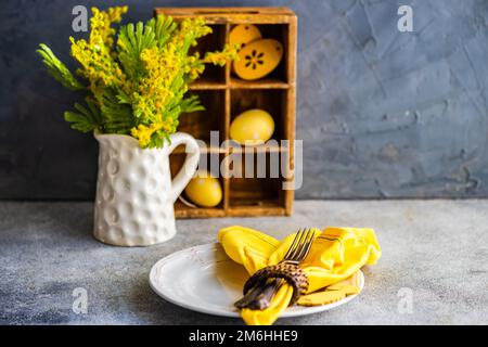 Easter table setting on concrete background Stock Photo