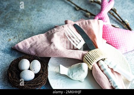 Easter table setting on concrete background Stock Photo