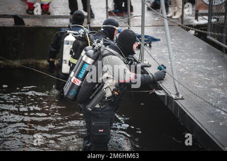 Prague, Czechia - December 18, 2022: Scuba Diver near Charles bridge in Prague Stock Photo
