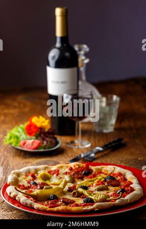 Fresh pizza with red wine Stock Photo