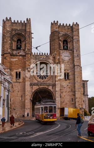 The Iconic and Famous Vintage Tram Number 28 in front of the Se Santa Maria Cathedral - Lisbon, Portugal Stock Photo