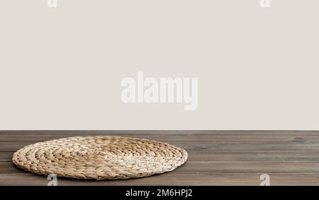 Dark wooden countertop with napkin and free space for installing the product or layout on the beige background. Copy  space. Stock Photo