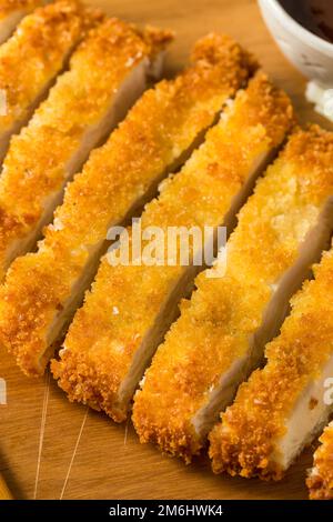 Homemade Japanese Chicken Tonkatsu with Cabbage and Lemon Stock Photo