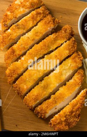 Homemade Japanese Chicken Tonkatsu with Cabbage and Lemon Stock Photo