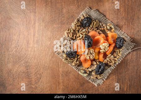 Nuts and other fruits on a wooden background Stock Photo