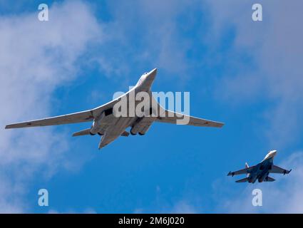 MOSCOW, RUSSIA - MAY 7, 2021: Avia parade in Moscow. su-35 and strategic bomber and missile platform Tu-160 in the sky on parade Stock Photo